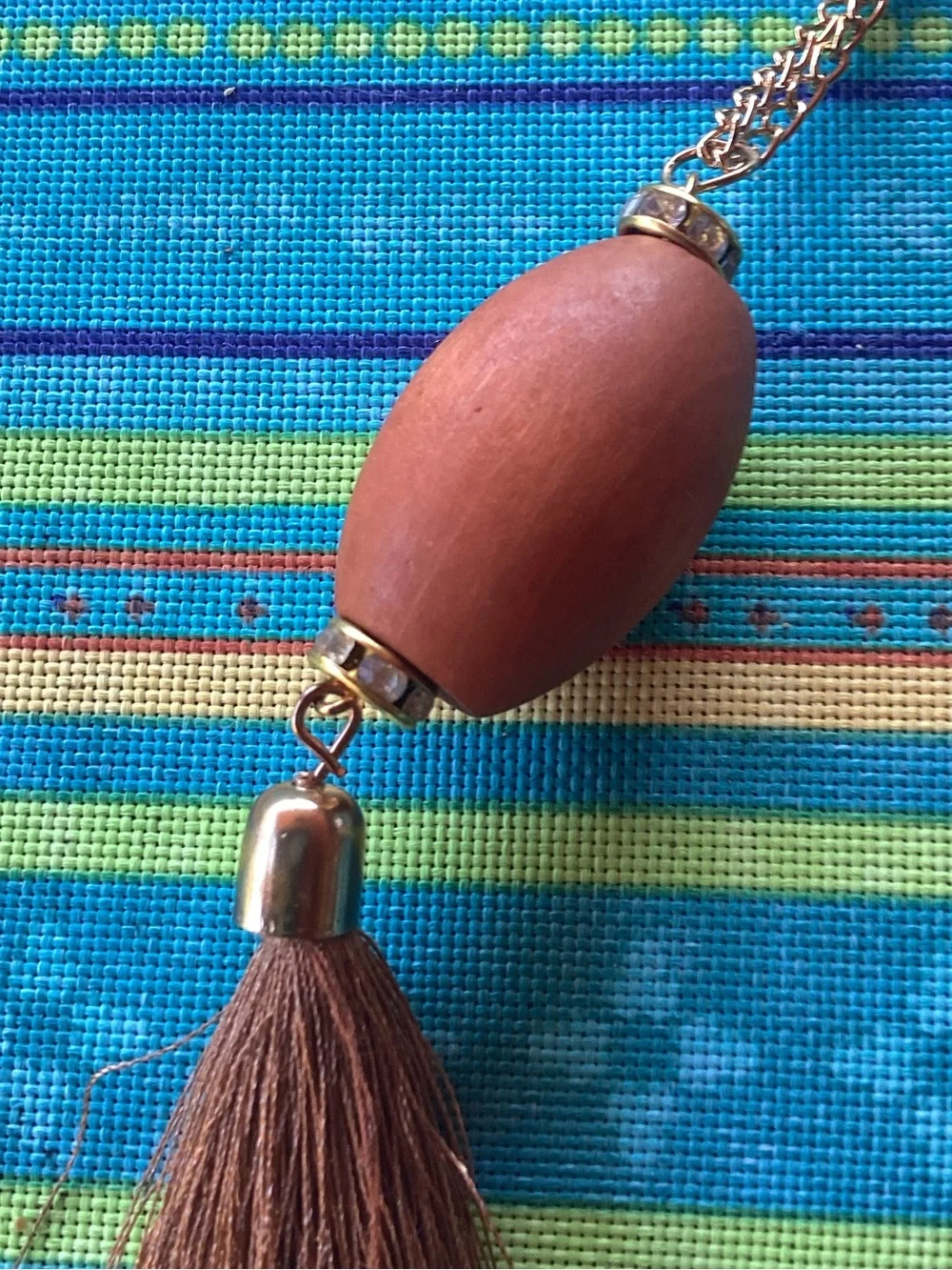 Superstar Accessories Necklace with wood, tassel and gold tone accents